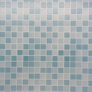 May include: Square mosaic tile sheet featuring a grid of small, square tiles in varying shades of blue and white. The tiles are arranged in a uniform pattern, creating a textured surface. The tile sheet is set against a brown background.