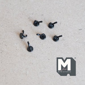 May include: Six black miniature hooks for hanging small items. The hooks are made of metal and have a simple design. They are perfect for adding a touch of style to any miniature project.