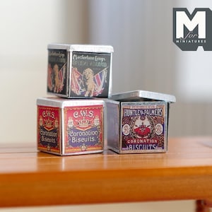 May include: Three miniature tin boxes with vintage labels. The top box is labeled "Macfarlane Langs Original Assorted", the middle two boxes are labeled "C.W.S. Coronation Biscuits", and the bottom box is labeled "Huntley & Palmers Coronation Biscuits".