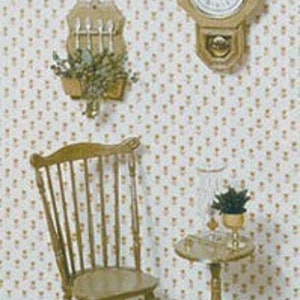 May include: A wooden chair with a spindle back and a small round wooden table with a glass top. A clock with a wooden frame and a plant in a gold pot are on the wall behind the chair and table.