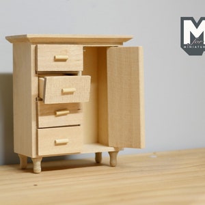 May include: A wooden cabinet with four drawers and a door. The cabinet is unfinished and has a natural wood color. The door is open and the drawers are partially open. The cabinet is sitting on a wooden surface.