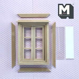 May include: A miniature wooden window frame kit featuring a central double-pane window with six grid sections, four separate trim pieces, and two clear rectangular acrylic inserts. The logo M for MINIATURES is visible in the top right corner.