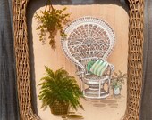 Vintage 1970s print of a peacock chair and houseplants framed in a wicker frame
