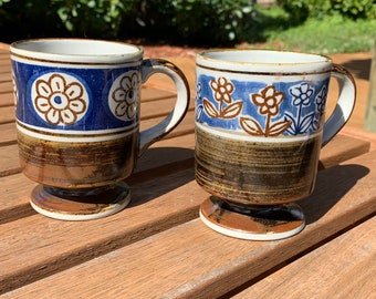 Pair of mid century modern pottery pedestal mugs