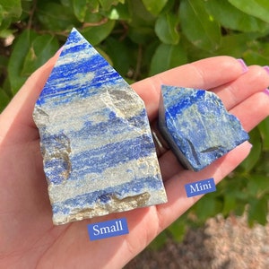 May include: Two blue lapis lazuli crystal points, one labeled "Small" and the other labeled "Mini".