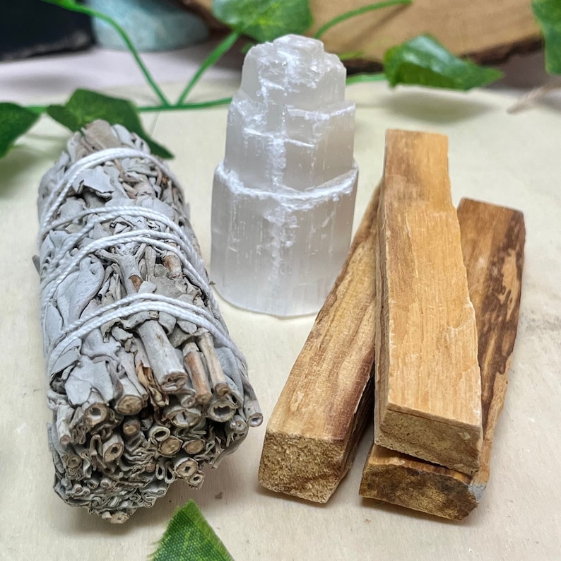 May include: A set of three smudging tools including a bundle of white sage, a selenite tower, and three palo santo sticks.