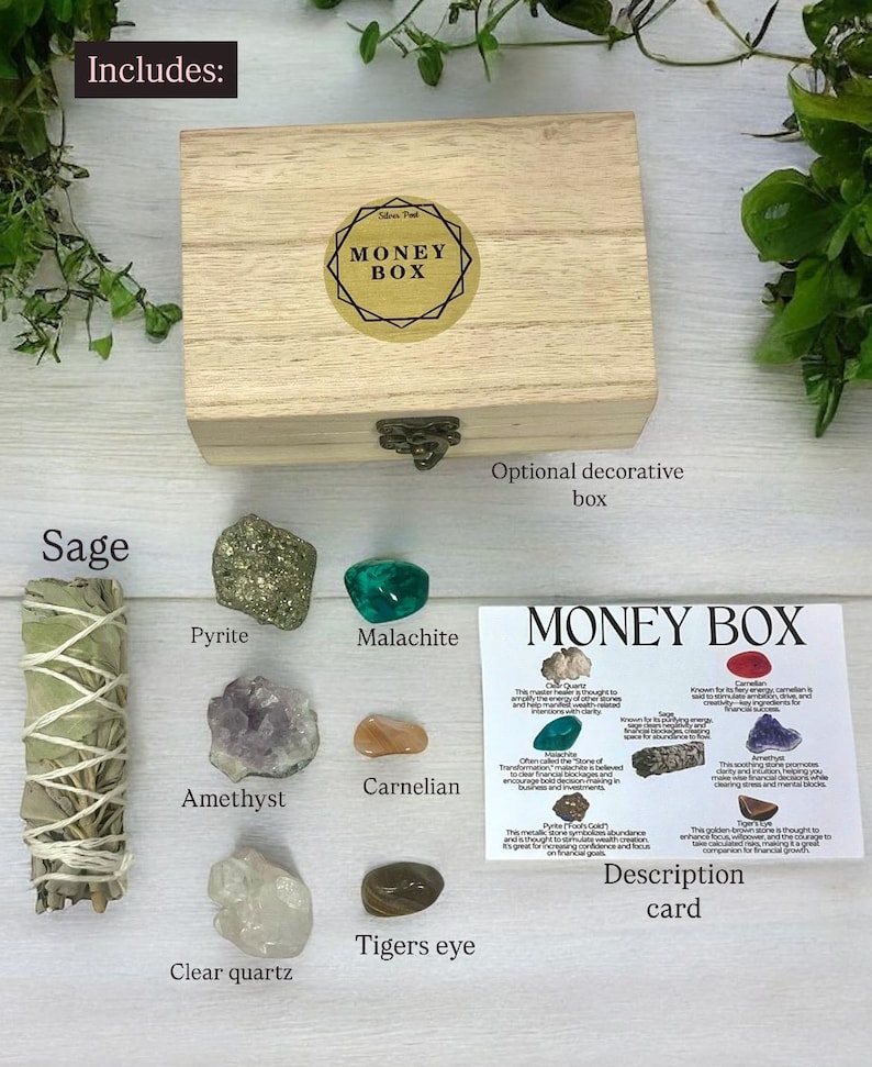 Peut inclure: Une bo&icirc;te en bois avec une &eacute;tiquette dor&eacute;e indiquant "Money Box". La bo&icirc;te est entour&eacute;e de divers cristaux et d'un b&acirc;tonnet de sauge. Les cristaux comprennent l'am&eacute;thyste, le quartz clair, la cornaline, la malachite, la pyrite et l'&oelig;il de tigre. Une carte avec le titre "Money Box" et des descriptions des cristaux est &eacute;galement incluse.