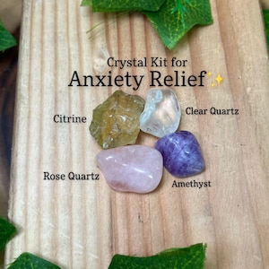 May include: A crystal kit for anxiety relief with four tumbled stones: clear quartz, amethyst, rose quartz, and citrine.