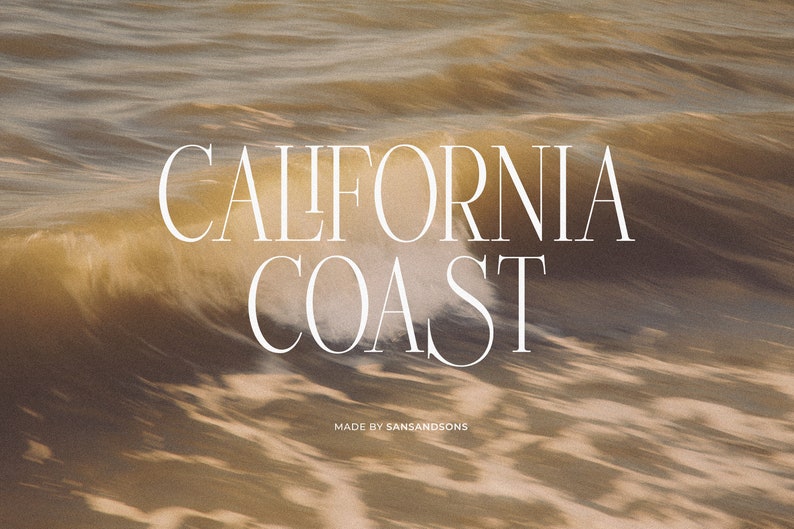 May include: A close-up of a wave crashing on a beach with the text "CALIFORNIA COAST" in white sans-serif font. The text is centered on the image and is below the wave. The text "MADE BY SANSANDSONS" is in smaller white sans-serif font below the main text.