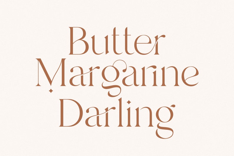 May include: A graphic design with the text "Butter Margarine Darling" in a brown font on a white background.