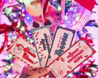May include: Four pink and blue Christmas-themed tickets with festive illustrations and text. The tickets read "A night to look at Christmas lights", "Movie night", "Bake Christmas Cookies", and "You are going to see Santa Claus!"