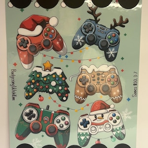 May include: A light green game board featuring six controller designs with holiday themes, including a Santa hat, reindeer antlers, a Christmas tree, and a snowman. The board has several black circles and text that reads "BudgetingWithKim" and "Saves $50, 3-7".