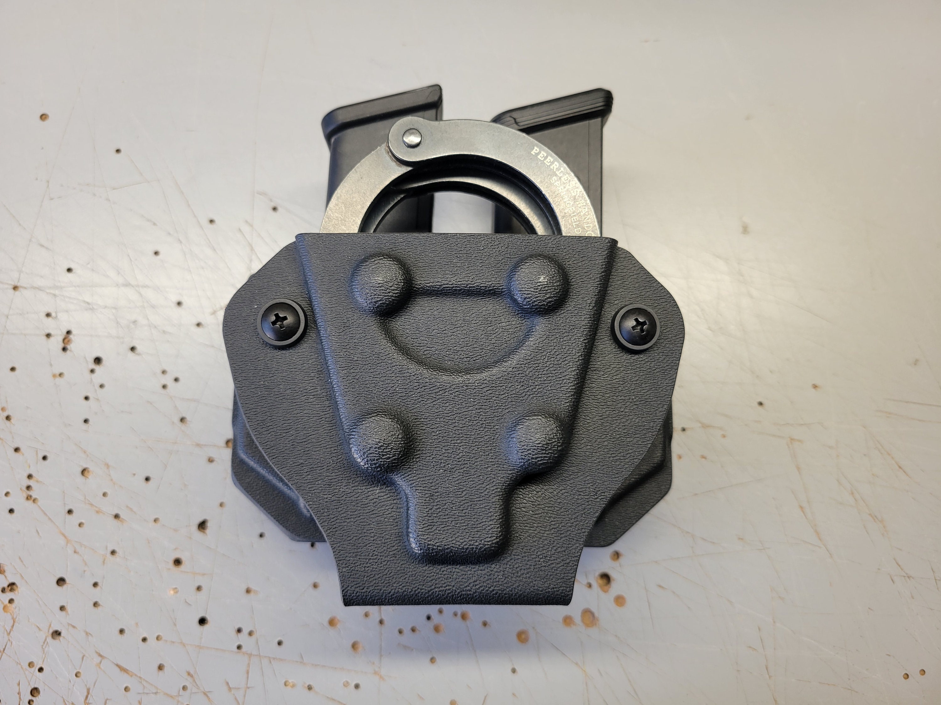 Kydex mag top and handcuff holder