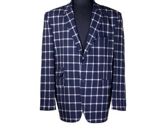 May include: A navy blue blazer with a white and navy plaid pattern. The blazer has a single button closure and two flap pockets.