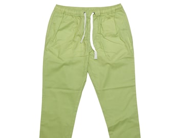 May include: Light green casual pants with a drawstring waist.
