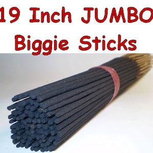 May include: A bundle of 19 inch jumbo incense sticks, tied together with a red ribbon. The sticks are black and have a natural wood core.