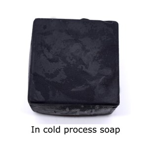 May include: A black bar of soap made using the cold process method.