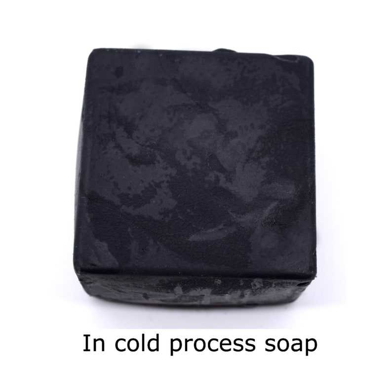 May include: A black bar of soap made using the cold process method.