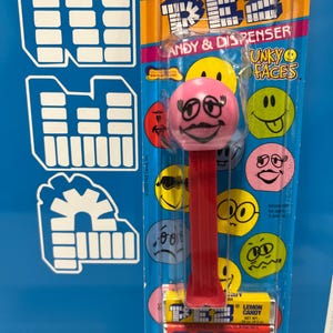 Funky Faces “Cheeky” PEZ Dispenser with red stem mint on card
