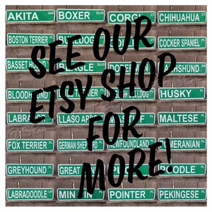 May include: A collage of green and white signs with dog breeds listed on them. The text "See our Etsy shop for more!" is written in large black letters over the signs.