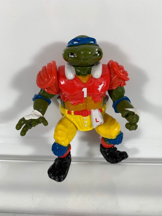 Vintage 1991 T.D. Tossin' Leo Football Player Leonardo Sewer