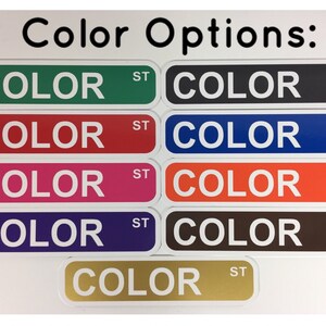 May include: Eight color options for a product, shown as rectangular labels with the word "COLOR" in white text and "ST" in black text. The colors are green, red, pink, purple, black, blue, orange, and brown.