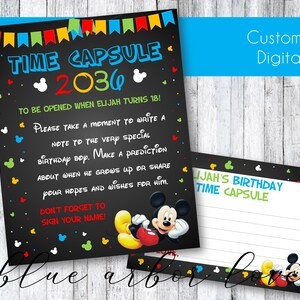 May include: A black time capsule card with the text "TIME CAPSULE 2036" and "TO BE OPENED WHEN ELIJAH TURNS 18!". Includes a Mickey Mouse graphic and space for a birthday message. A matching card is also shown.