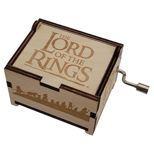 May include: A rustic wooden sign with the text "Welcome to our home" in white lettering. The sign features a distressed finish and a simple, inviting design, perfect for entryway decor.