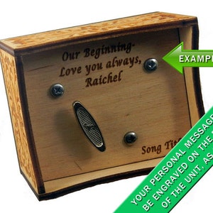 May include: A wooden music box with a slot for a crank and a small metal plate. The box has a personalized message engraved on the top: "Our Beginning- Love you always, Raichel". The bottom of the box has a message that reads: "Your personal message will be engraved on the bottom of the unit, as shown".
