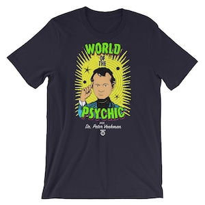 May include: A navy blue t-shirt with a graphic of a cartoon man with a green thought bubble above his head. The text "World of the Psychic" is in green and yellow letters. The text "with Dr. Peter Venkman" is in white letters.