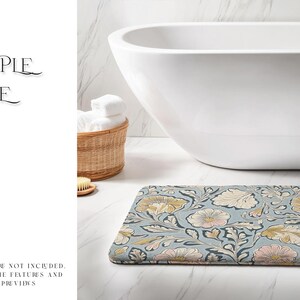 May include: A blue and white floral bath mat with a white bathtub in the background.