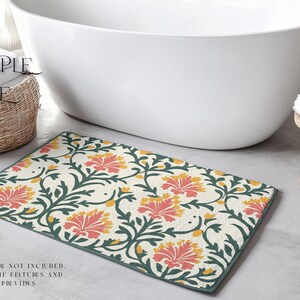 May include: A white bathroom rug with a floral pattern in shades of green, yellow, and pink. The rug has a cream background and features a repeating design of stylised flowers and leaves.