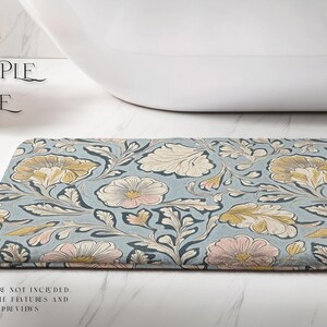 May include: A blue and white floral bath mat with a delicate pattern. The mat has a soft, textured surface and is ideal for adding a touch of elegance to any bathroom.