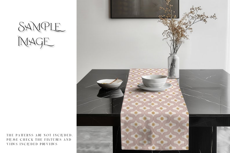 May include: A pink and gold table runner with a geometric pattern. The runner is on a black table with a white bowl and a vase with dried flowers.