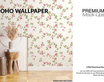 Puede incluir: Una maqueta de un marco blanco con un papel tapiz floral que presenta un patrón repetitivo de rosas rosas y hojas verdes. El papel tapiz está etiquetado como "BOHO WALLPAPER". El marco está sentado en un suelo de madera con un pequeño taburete de madera y dos contenedores metálicos decorativos.