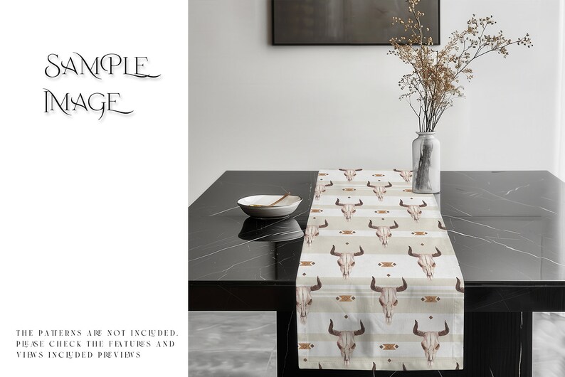 May include: A beige table runner with a repeating pattern of brown bull skulls and geometric designs. The runner is on a black table with a white bowl and a vase of dried flowers.