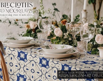 May include: A table setting with a white tablecloth with a blue and white geometric pattern. The table is set with white plates, bowls, and glasses. There are flowers in the background.