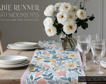 May include: A floral table runner with a pink, yellow, and green pattern. The runner is on a wooden table with white plates, glasses, and a bouquet of white roses.