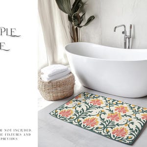 May include: A white bathtub with a floral patterned bath mat in shades of green, yellow, and pink. The mat is placed on a light grey tiled floor.
