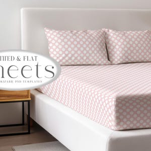 May include: A bed with a white headboard and a fitted sheet set. The sheets and pillowcases are light pink with a white polka dot pattern. The text "Fitted & Flat Sheets" is in the image.
