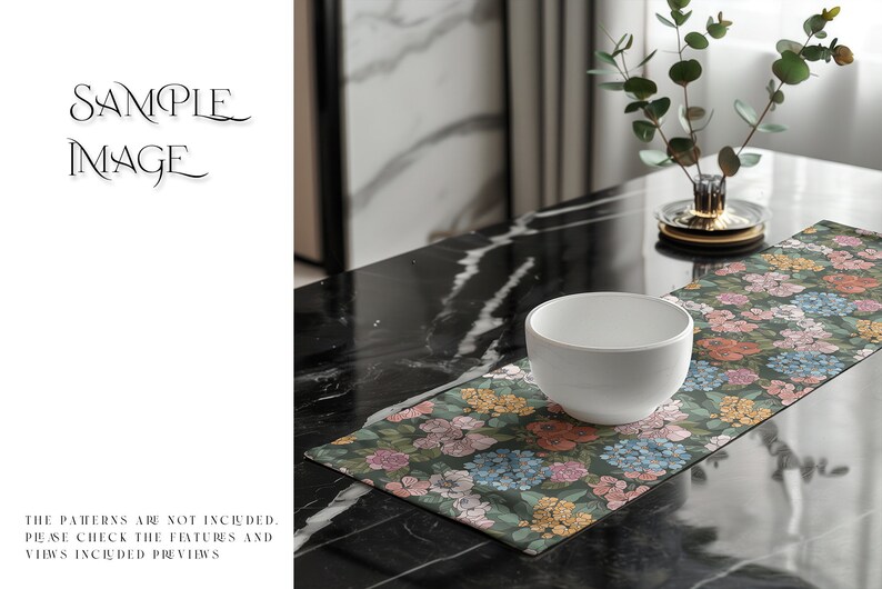 May include: A white ceramic bowl sits on a floral table runner with a green background. The runner has pink, yellow, and blue flowers. The table runner is on a black marble table.