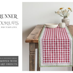 May include: Red and white checkered table runner with a green and white border. The runner is on a wooden table with a white bowl and a vase of white flowers.