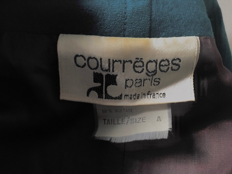 May include: White tag with black text reading "Courr&egrave;ges Paris made in France" and a black and white logo. Below the tag is a white tag with black text reading "Taille/Size A".