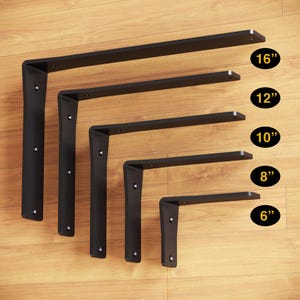 May include: Five black metal shelf brackets of different sizes, ranging from 6 inches to 16 inches. The brackets are arranged in order of size, with the largest bracket at the top and the smallest bracket at the bottom.