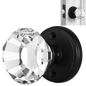 May include: Black door knob with a clear crystal faceted knob. The knob is round and has a black metal base.