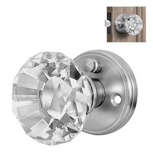 May include: A silver door knob with a clear crystal faceted knob. The knob has a simple design and is a great addition to any home.