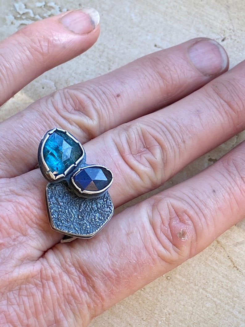 Step Up Sterling Silver Hollow Form and Blue Gems Ring