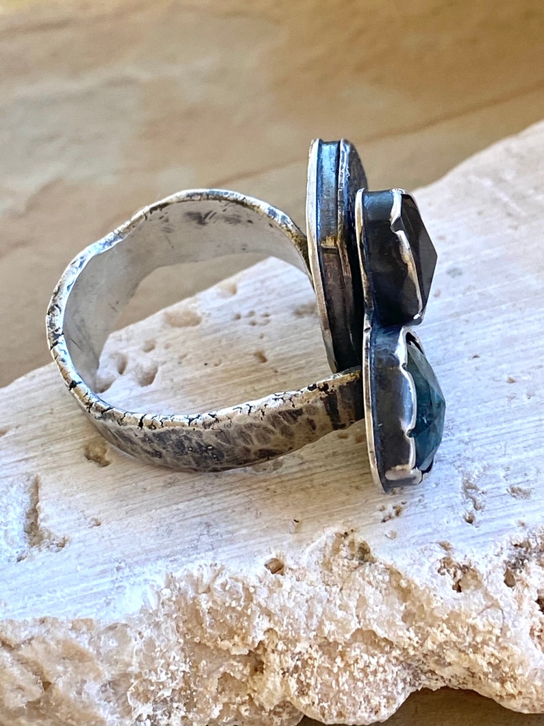 Step Up Sterling Silver Hollow Form and Blue Gems Ring