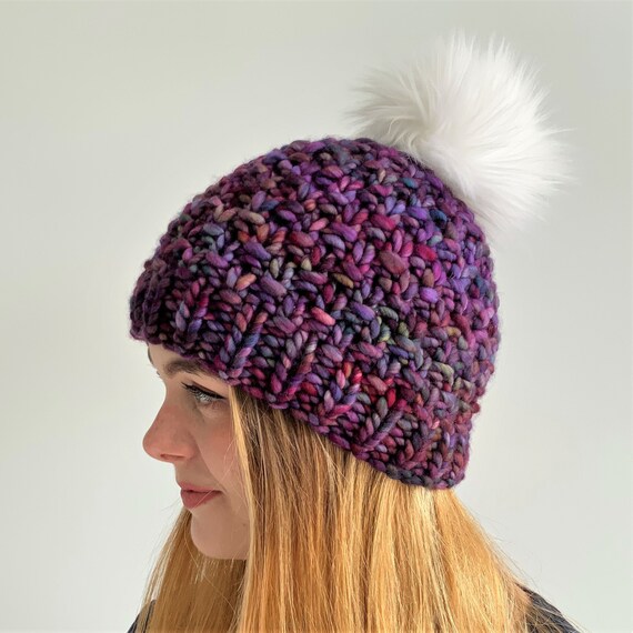 Flat hat with a pom pom hotsell