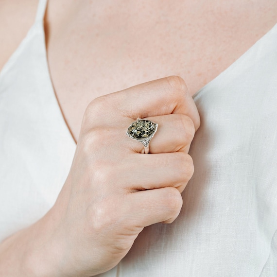 Green amber best sale rings